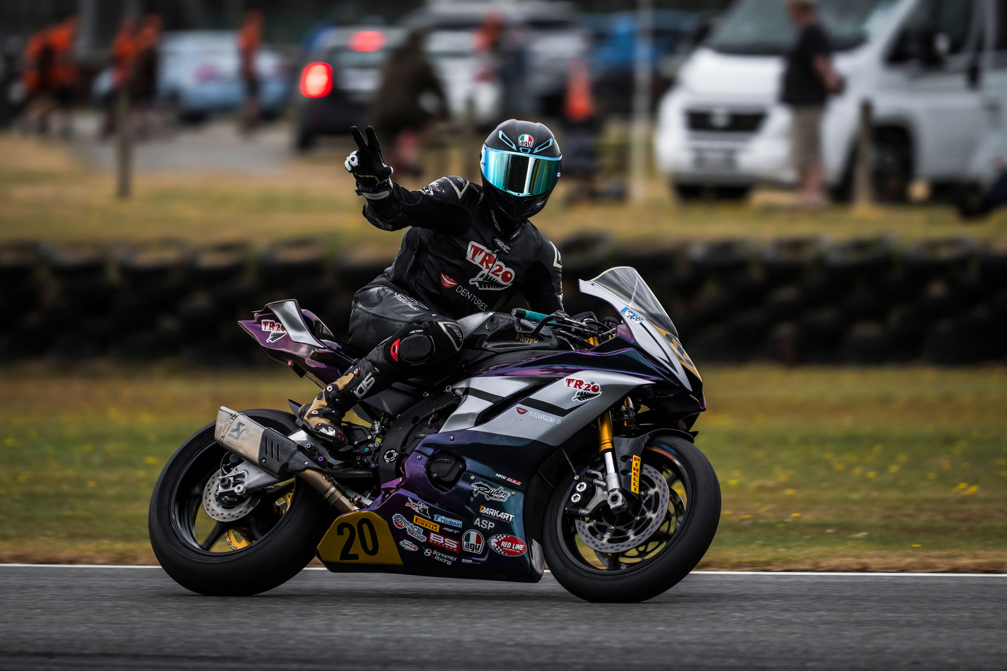 TR20 rider on a race motorcycle at a circuit.